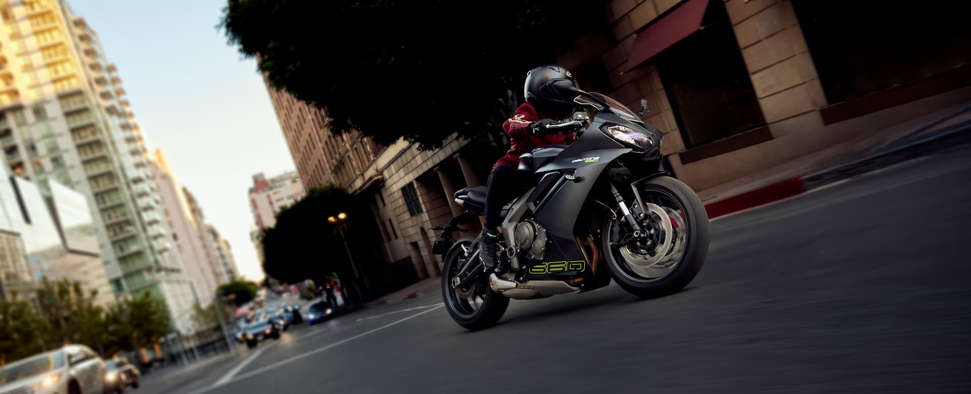 Triumph Daytona 660 in satin granite and satin jet black riding through city